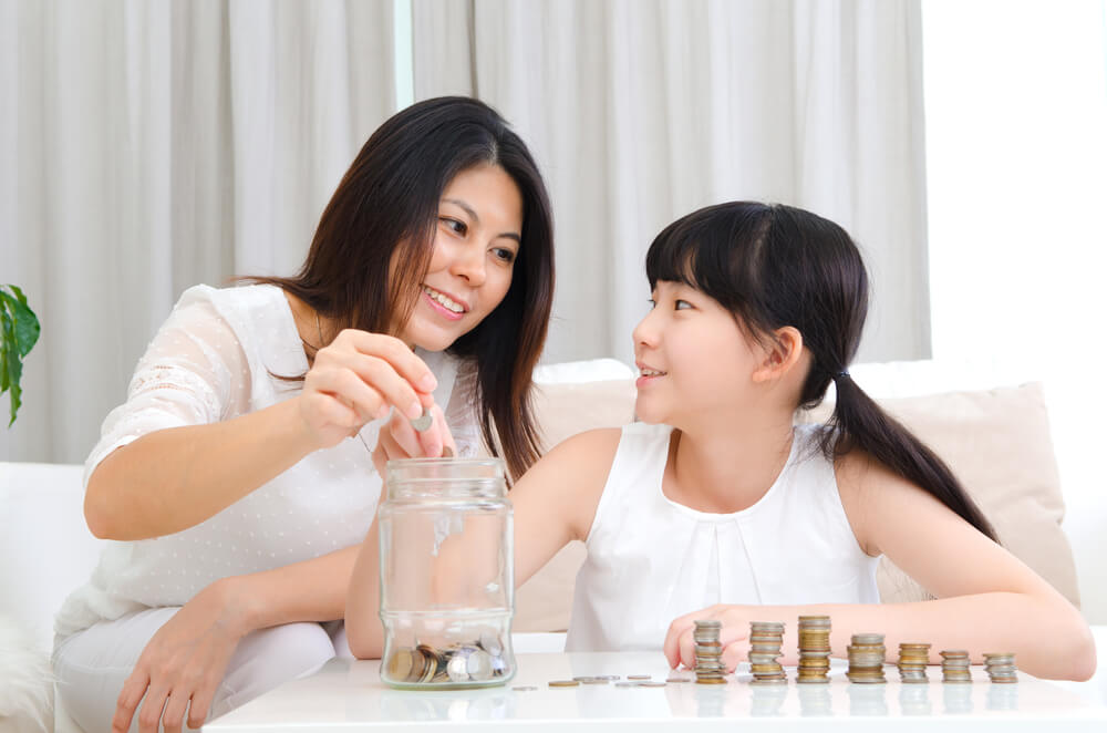 mother and daughter saving up for HDB Resale Levy