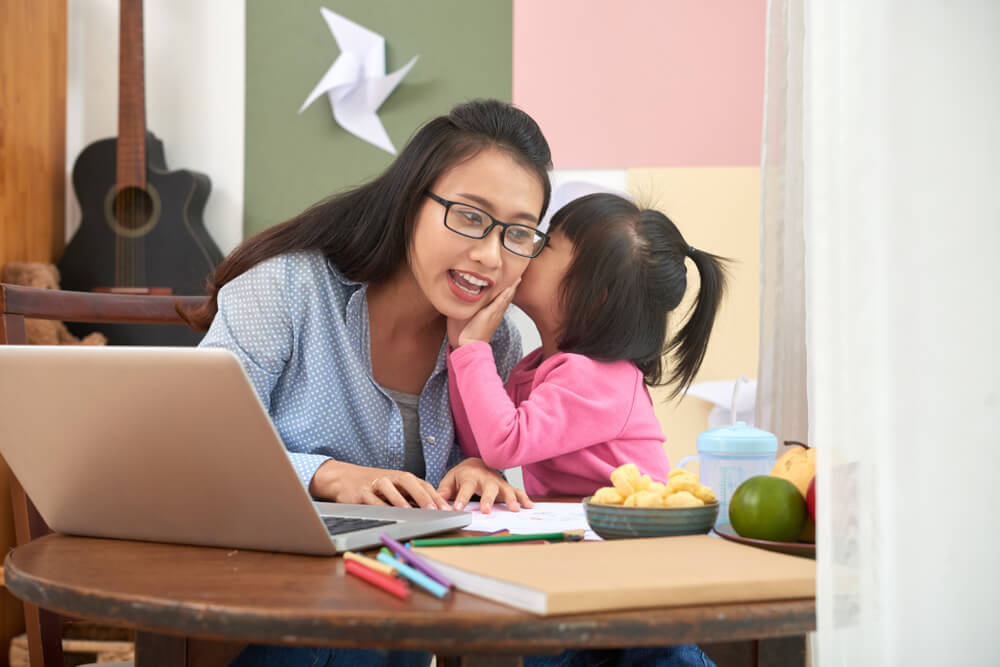 how-work-home-even-kids-around-child-whispering-to-mother