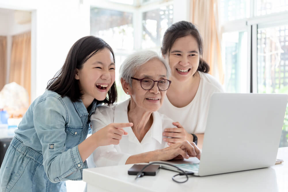 how-keep-seniors-happy-home-during-covid-19-pandemic-three-generations-laptop