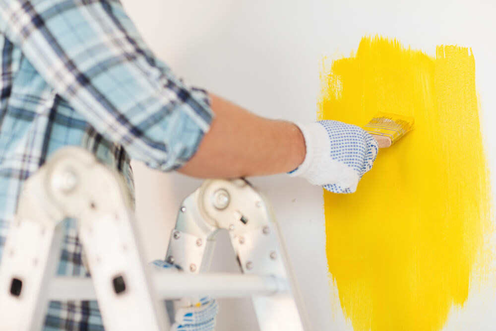 wear gloves-tips-for-a-mess-proof-DIY-wall-painting