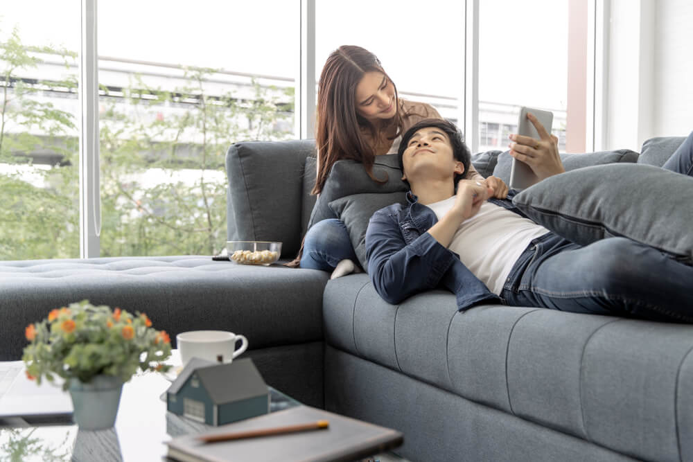 guide-first-time-renters-malaysia-couple-chilling-on-sofa