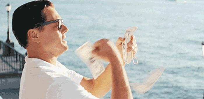 GIF of Leonardo DiCaprio in Wolf of Wall Street throwing money