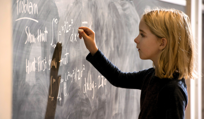 McKenna Grace in the movie Gifted, answering a math problem on the chalkboard